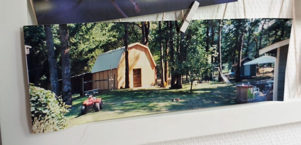Picture of a panorama photograph showing a barn among trees.